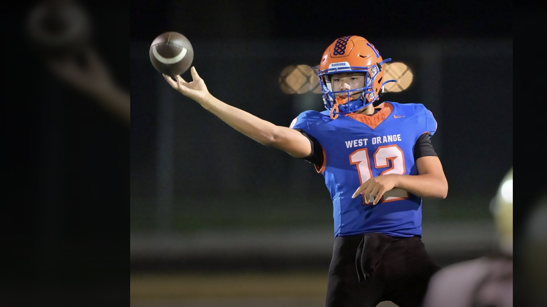 West Orange quarterback extending the football before a game